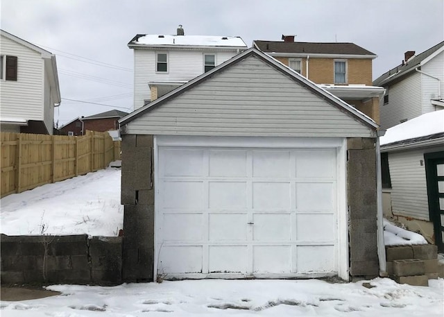 view of snow covered garage