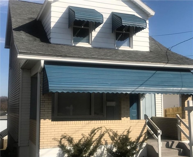 1821 Abraham St, Mckeesport, PA 15132 - view of front of home featuring brick siding and a shingled roof