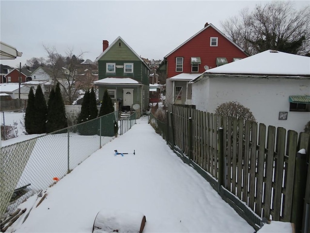 view of yard layered in snow