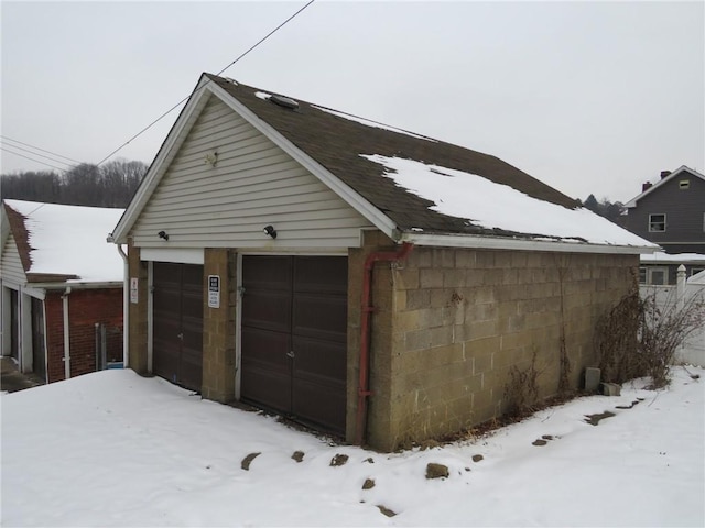 view of snow covered garage