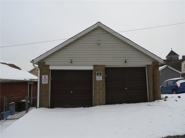 view of snow covered garage