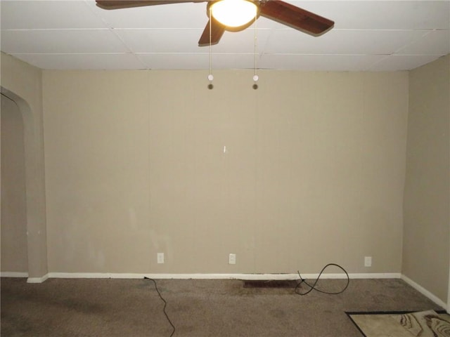 carpeted empty room with a drop ceiling