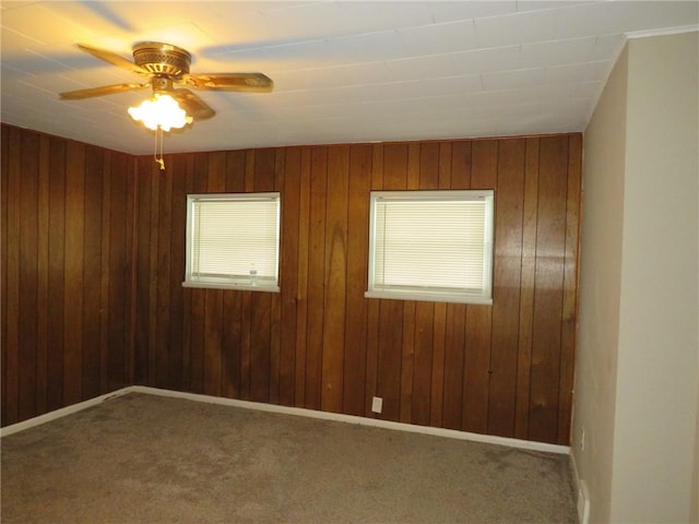 empty room with ceiling fan and carpet