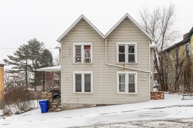 view of snow covered house