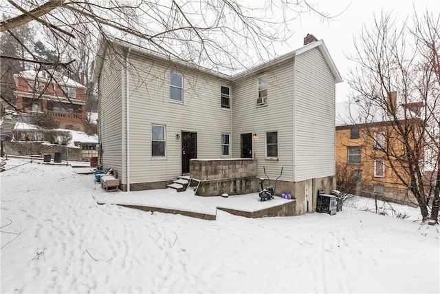 view of snow covered house