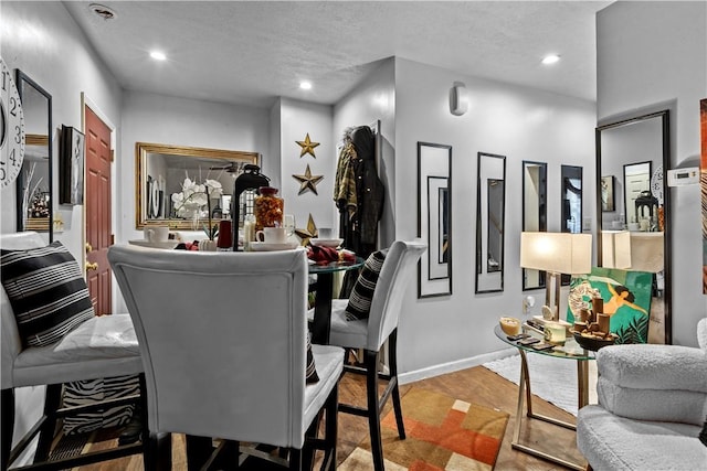 dining area with a textured ceiling