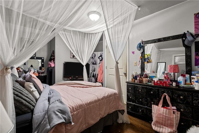 bedroom with wood-type flooring