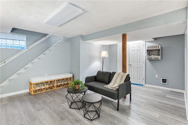 living room featuring hardwood / wood-style flooring and heating unit