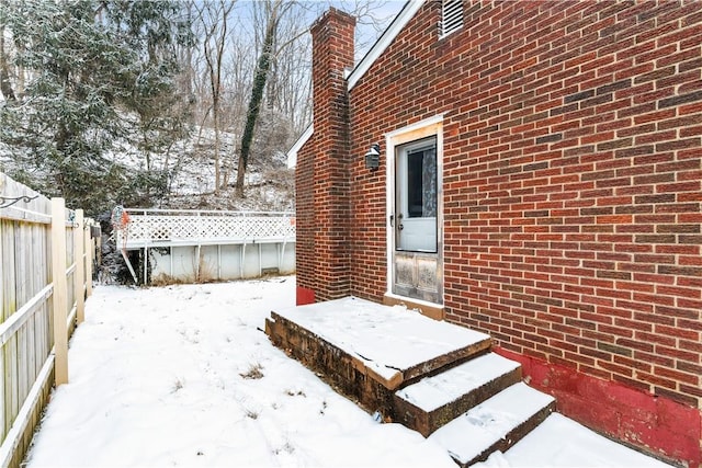 view of yard layered in snow