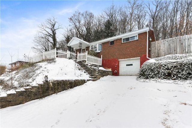 view of front of property featuring a garage