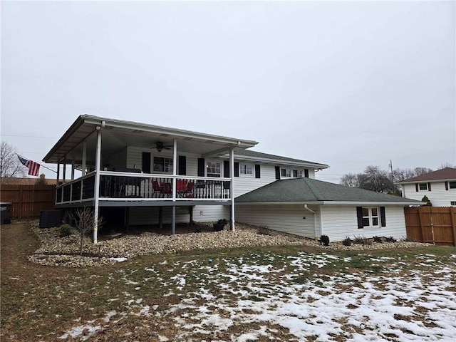 snow covered property featuring ceiling fan