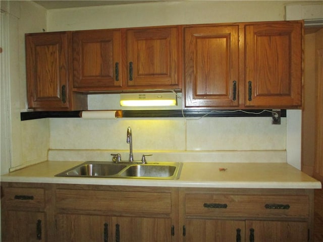 kitchen with sink and tasteful backsplash