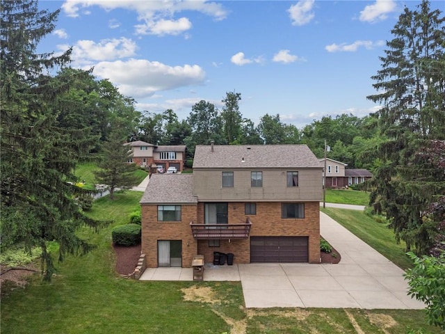 rear view of property featuring a garage, a patio, and a lawn