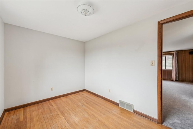 unfurnished room with light wood-type flooring