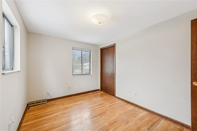 empty room with light wood-type flooring