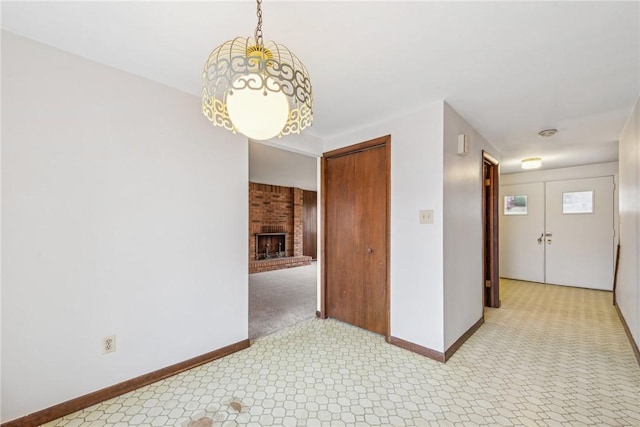 interior space featuring a brick fireplace