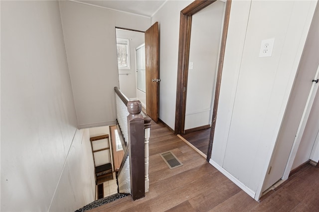 corridor with wood-type flooring