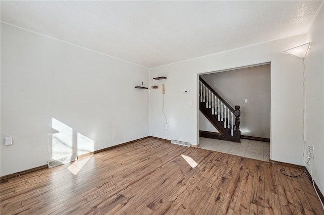 unfurnished living room featuring light hardwood / wood-style flooring