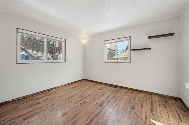 unfurnished room featuring light hardwood / wood-style floors