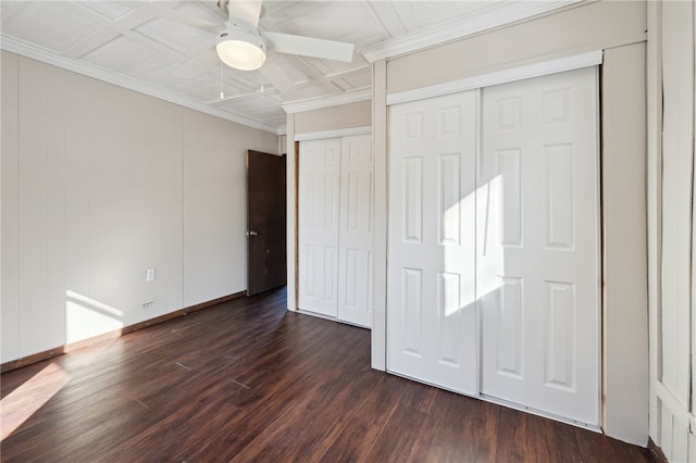 unfurnished bedroom featuring ceiling fan, crown molding, and dark hardwood / wood-style floors