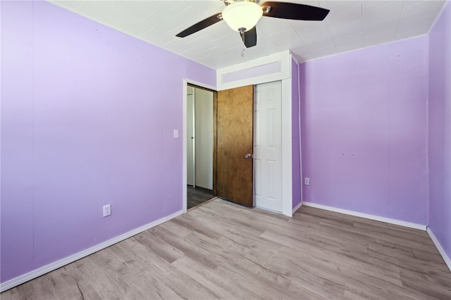 unfurnished bedroom featuring ceiling fan and light wood-type flooring