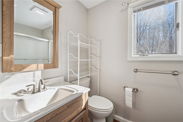 bathroom with toilet and vanity