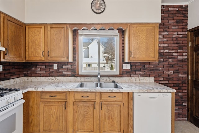 kitchen featuring white appliances and sink