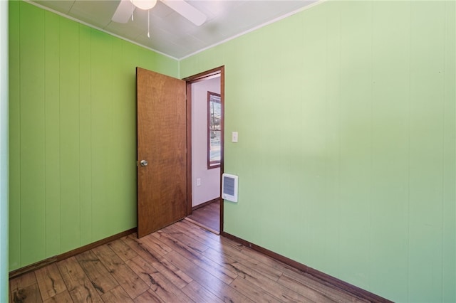 spare room with ceiling fan, ornamental molding, and light hardwood / wood-style flooring