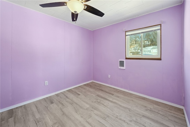 spare room featuring ceiling fan and light hardwood / wood-style flooring