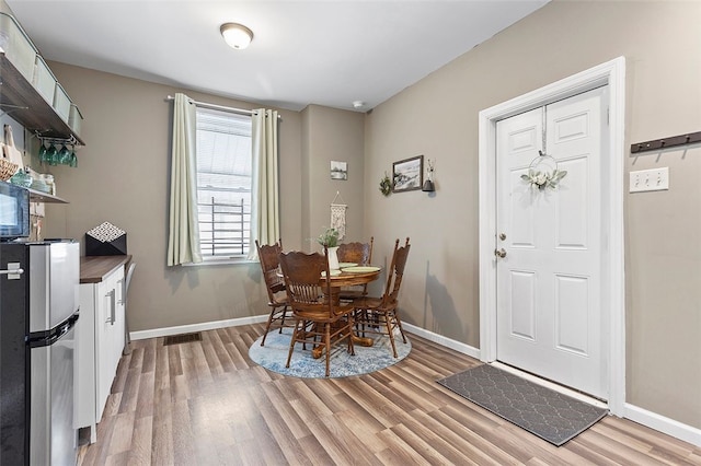 dining space featuring light hardwood / wood-style floors