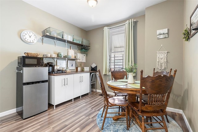 dining space featuring light wood-type flooring