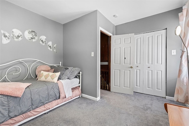 carpeted bedroom featuring a closet