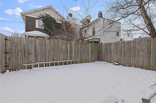 view of yard covered in snow