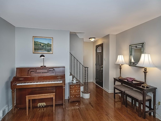 foyer with dark hardwood / wood-style floors