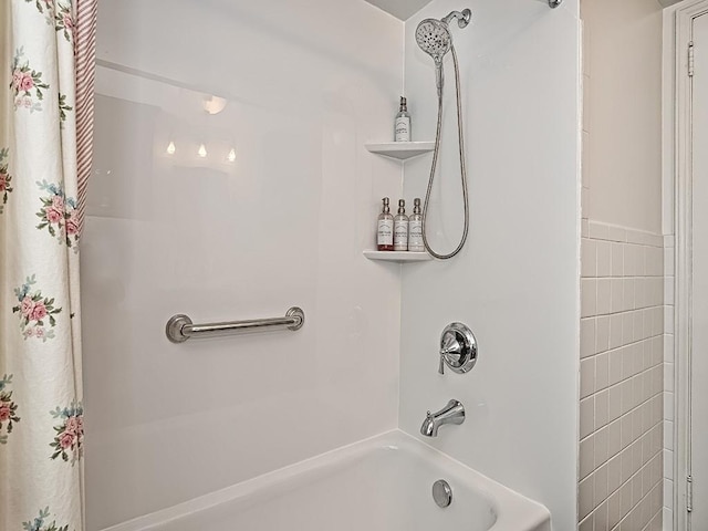 bathroom featuring tile walls and shower / tub combo with curtain