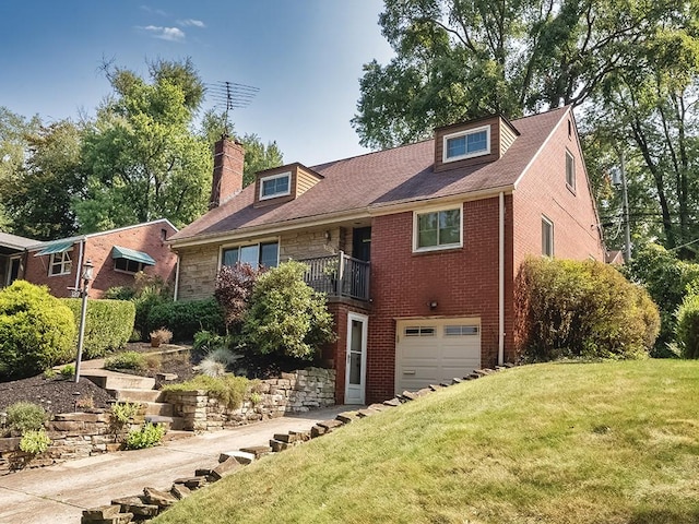 view of front facade featuring a balcony, a front lawn, and a garage