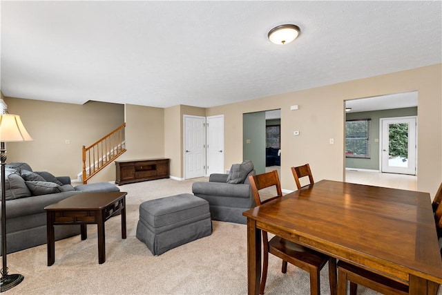 living room featuring light carpet