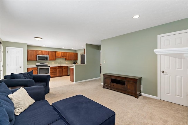 living room featuring sink and light colored carpet