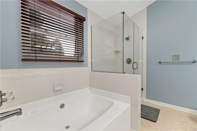 bathroom with tile patterned flooring and independent shower and bath