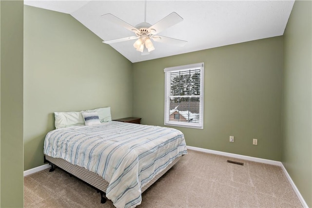 bedroom with carpet flooring, ceiling fan, and vaulted ceiling