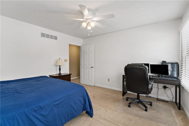 carpeted bedroom with ceiling fan and multiple windows