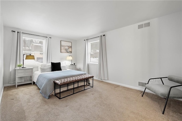 bedroom with light colored carpet