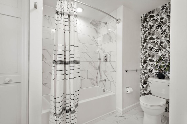 bathroom featuring shower / tub combo and toilet