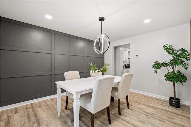 dining space featuring light wood-type flooring