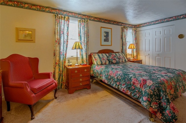 bedroom featuring a closet and carpet