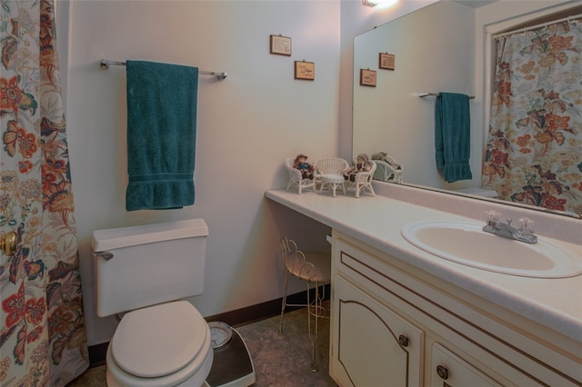 bathroom featuring vanity and toilet