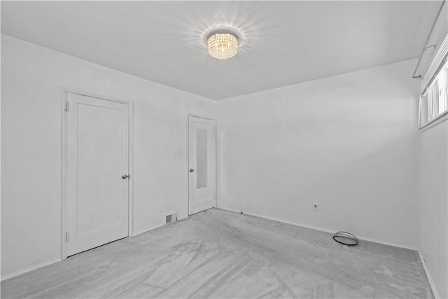 unfurnished bedroom featuring light colored carpet