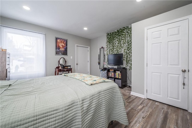 bedroom featuring dark hardwood / wood-style flooring