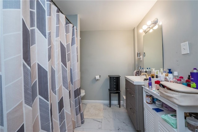 bathroom with vanity and toilet