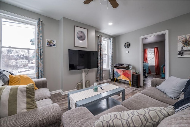 living room with dark wood-type flooring and ceiling fan